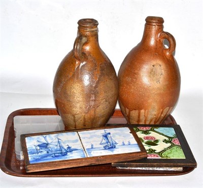 Lot 261 - A pair of Earthenware jugs, together with a Mintons tile, two Delft tiles, another and a small...