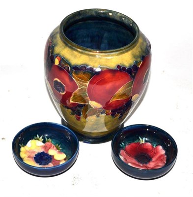 Lot 275 - A William Moorcroft Pomegranate pattern vase (a.f.), together with two Moorcroft pottery...