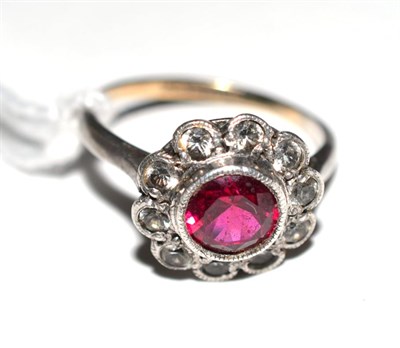 Lot 282 - 9ct gold, silver, ruby and diamond ring of flower head form