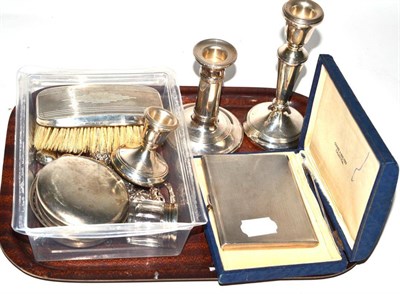 Lot 291 - A small quantity of silver including dwarf candlesticks, cigarette case, hand brush, etc and...