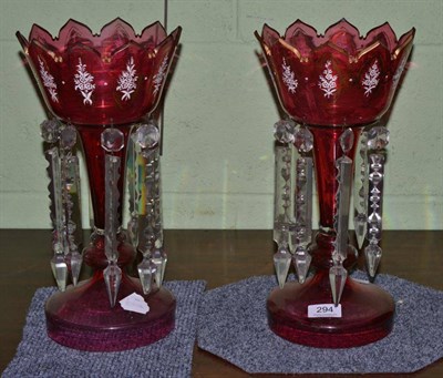 Lot 294 - A pair of Victorian cranberry table lustres