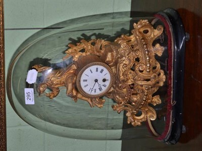 Lot 295 - A French figural gilt metal mantel clock in glass dome