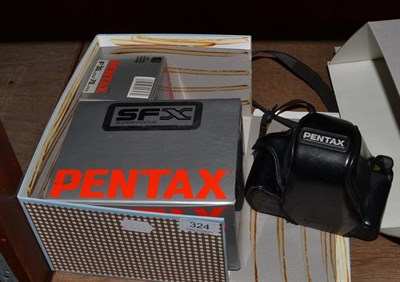 Lot 324 - Pentax SFX Camera with SMC Pentax-F f3.5-4.5, 35-70mm lens, in leather case, with three...