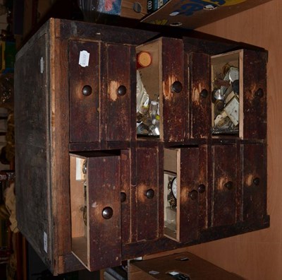 Lot 347 - A watchmakers cabinet containing wristwatches, three stopwatches and watchmakers parts etc