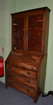 Lot 438 - A late George III mahogany bureau bookcase