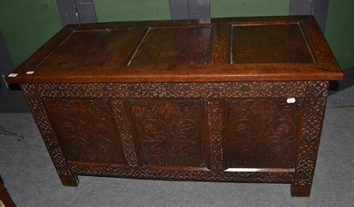 Lot 439 - A 19th century carved and panelled oak coffer