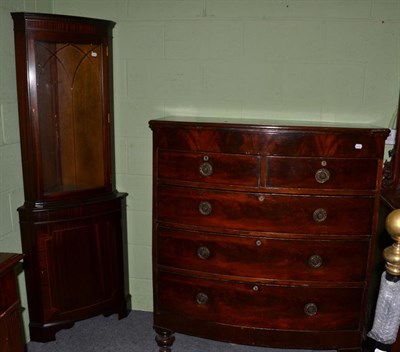 Lot 444 - A Victorian mahogany bow fronted four height chest of drawers and a reproduction standing...