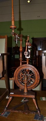 Lot 463 - A good early spinning wheel, circa 1780-1820, the mahogany frame with inlaid overlapping disks...