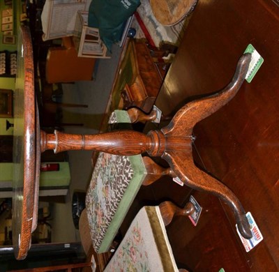 Lot 468 - A George III oak flip top tripod table