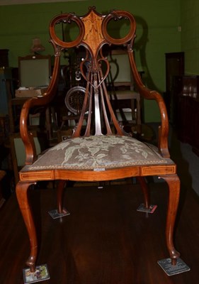 Lot 471 - An Edwardian inlaid mahogany elbow chair