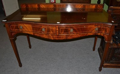 Lot 479 - A mahogany serpentine fronted side table (en suite with previous lot)