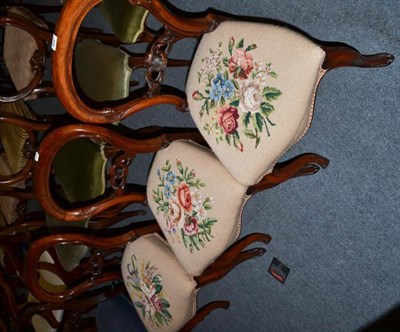 Lot 486 - A Victorian harlequin set of seven walnut balloon back dining chairs (one a.f.)