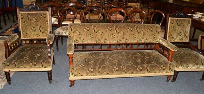 Lot 487 - A late Victorian oak framed three piece suite with matching walnut framed settee