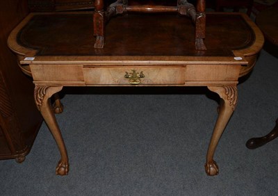 Lot 502 - A 1920's leather top writing table