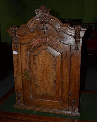 Lot 509 - A Flemish oak cupboard, bearing date 1763