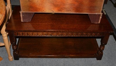 Lot 518 - A reproduction oak coffee table