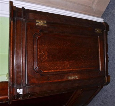 Lot 527 - A George III oak wall hanging corner cupboard