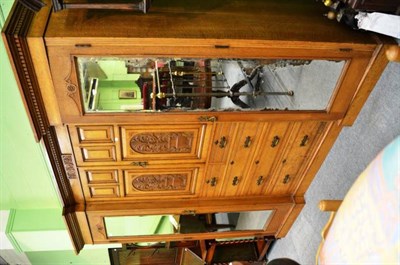 Lot 529 - A&nbsp;Victorian inverted breakfront, carved panel and mirror fronted oak triple wardrobe