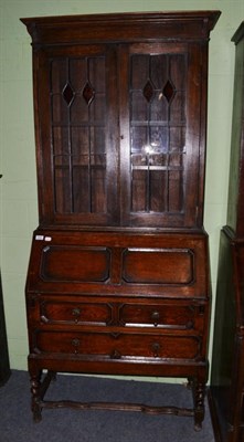 Lot 532 - A 1920's oak bureau bookcase