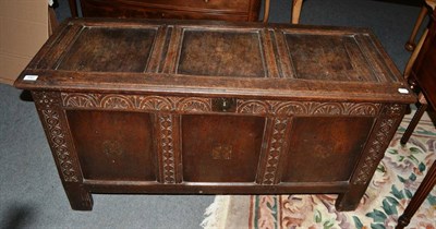 Lot 540 - An 18th century lunette carved three panel oak coffer