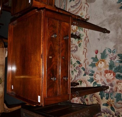 Lot 541 - A 19th century mahogany washstand, the rectangular top sliding to reveal fitted interior with...