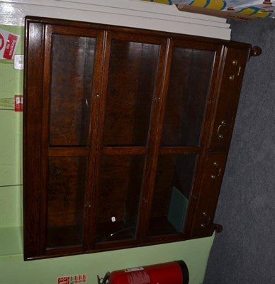 Lot 550 - An oak three tier glazed stacking bookcase