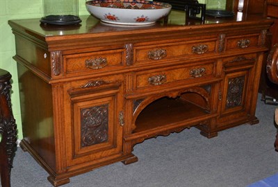 Lot 553 - A carved oak sideboard