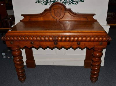 Lot 555 - A late Victorian oak side table, the moulded rectangular top above a boldly gadrooned frieze,...