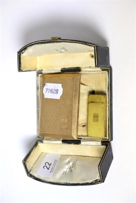 Lot 22 - A 9ct gold cigarette case and a gilt metal lighter