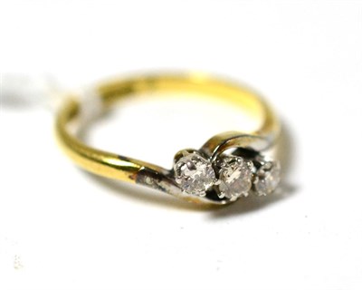 Lot 32 - A diamond three stone ring