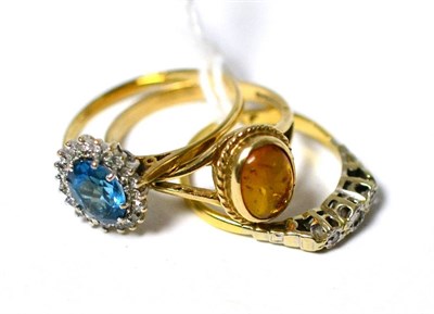 Lot 38 - Two 9ct gold dress rings and a diamond three stone ring