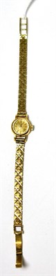 Lot 43 - A lady's 9ct gold wristwatch, signed Longines, on a 9ct gold bracelet