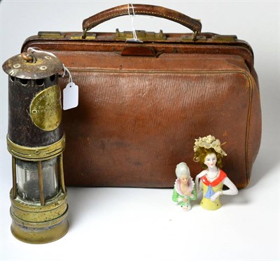 Lot 67 - Brown gladstone bag with red leather interior, two china half dolls and a Hailwood & Ackroyd...