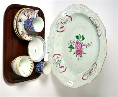 Lot 70 - An 18th century famille rose oval basin, tea bowls and saucers