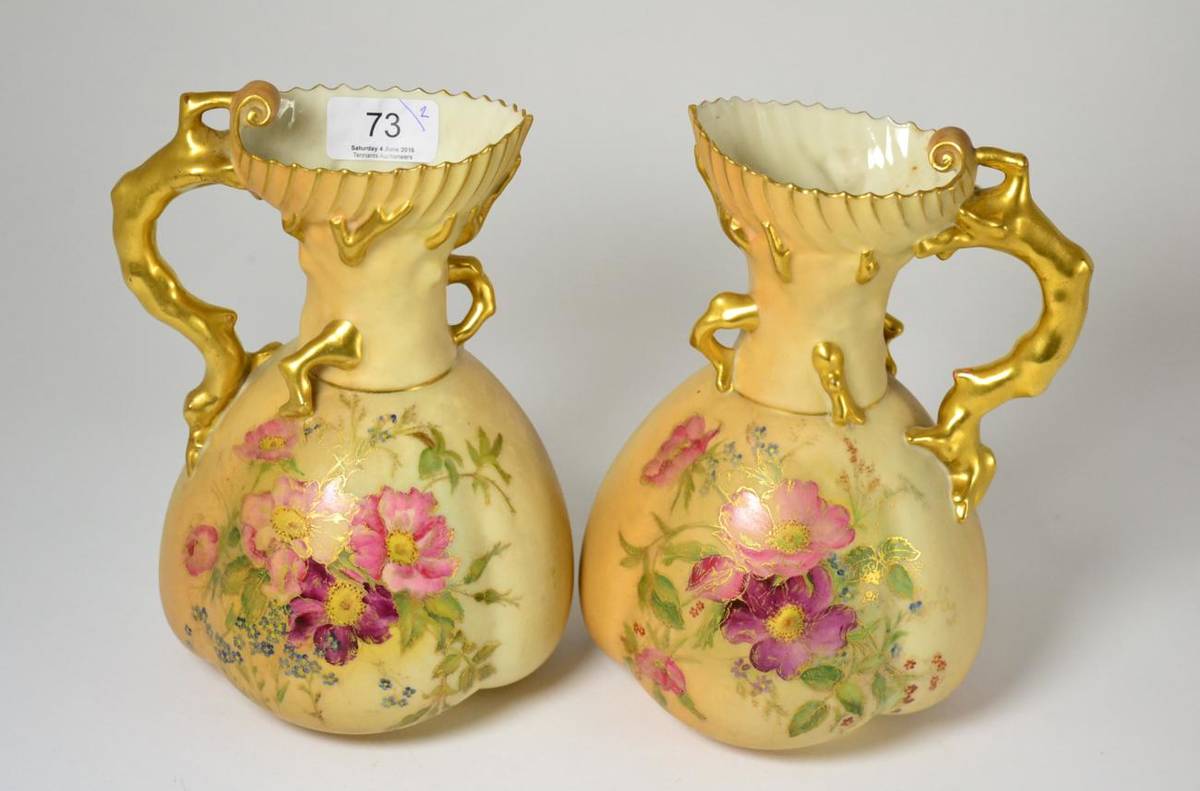 Lot 73 - A pair of Royal Worcester blush ivory jugs, shape number 1507, with puce marks