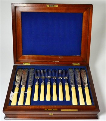 Lot 81 - A cased set of plated fish eaters, with pierced decorative blades, in mahogany case