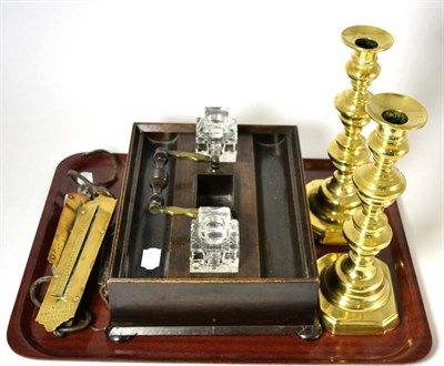 Lot 95 - A mahogany ink stand, three spring balances and a pair of brass candlesticks