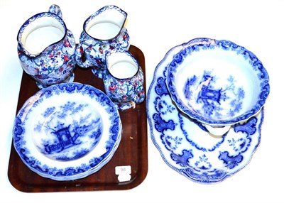 Lot 98 - A set of three Ringtons jugs, Flow Blue bowl, four soup bowls and a platter