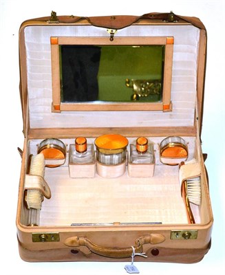 Lot 114 - A leather travel case with enamel fittings