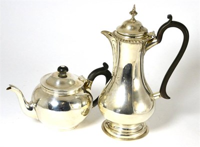 Lot 123 - A silver teapot and a James Dixon & Sons silver hot water jug (2)