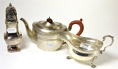 Lot 144 - A silver teapot, sauce boat and sugar caster