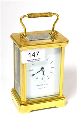 Lot 147 - A Garrard brass carriage timepiece with fitted box