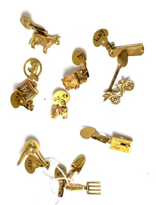 Lot 203 - Ten assorted charms, including a fork and trowel and a cow