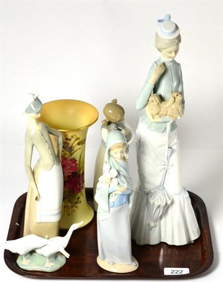 Lot 222 - Royal Worcester blush ivory flared vase and four Lladro figure groups (5)