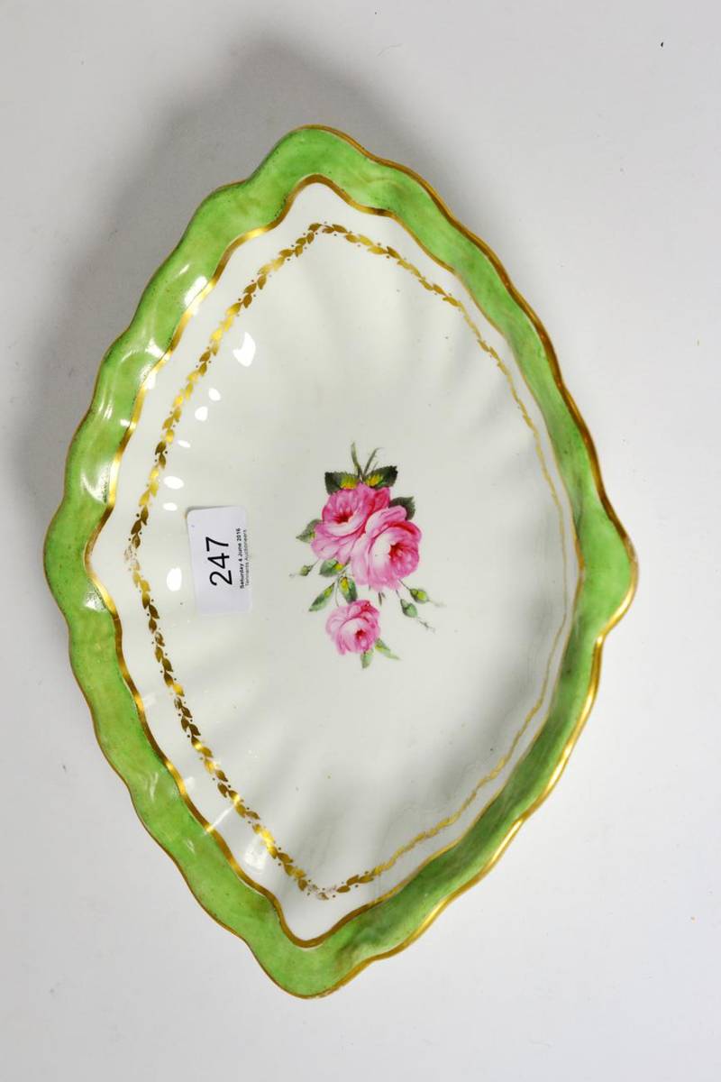 Lot 247 - A lozenge shape dessert dish, painted with pink roses within a green and gilt border, painted...