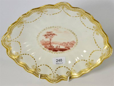 Lot 248 - A Derby porcelain dessert dish, circa 1785, painted in sepia monochrome with three figures in a...