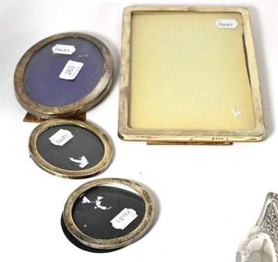 Lot 263 - Rectangular silver photograph frame, an oval silver photograph frame and a pair of circular...