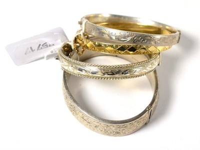 Lot 304 - A gold plated bracelet and three silver bracelets