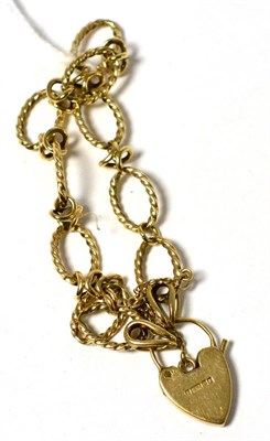 Lot 306 - A fancy link bracelet with heart shaped padlock