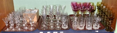 Lot 329 - A shelf of various drinking glasses including champagnes, wines and tumblers